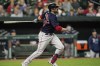 Boston Red Sox designated hitter J.D. Martinez watches his ball as he hits a solo home run off Baltimore Orioles starting pitcher Zac Lowther during the second inning of a baseball game, Wednesday, Sept. 29, 2021, in Baltimore. (AP Photo/Julio Cortez)