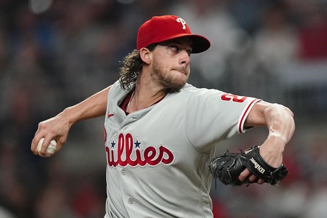 Philadelphia Phillies starting pitcher Aaron Nola (27) delivers in the second inning of a baseball game against the Atlanta Braves Wednesday, Sept. 29, 2021, in Atlanta. (AP Photo/John Bazemore)
