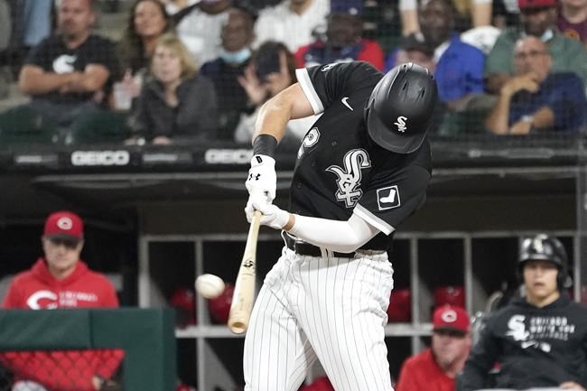 Chicago White Sox designated hitter Gavin Sheets hits a two-run home run off Cincinnati Reds starting pitcher Sonny Gray during the third inning of a baseball game Wednesday, Sept. 29, 2021, in Chicago. (AP Photo/Charles Rex Arbogast)