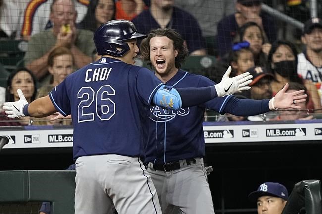 Tampa Bay Rays' Ji-Man Choi (26) celebrates with Brett Phillips after hitting a three-run home run against the Houston Astros during the fifth inning of a baseball game Wednesday, Sept. 29, 2021, in Houston. (AP Photo/David J. Phillip)