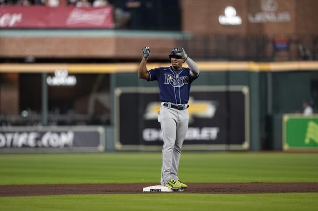 Tampa Bay Rays' Wander Franco celebrates after hitting a double against the Houston Astros during the first inning of a baseball game Wednesday, Sept. 29, 2021, in Houston. Franco's double extended his on-base streak to 43 games. (AP Photo/David J. Phillip)