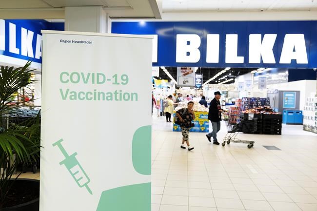 A view of a pop-up COVID-19 vaccination day in the supermarket Bilka, in Ishoej, Denmark, Saturday, Sept. 11 2021. Companies and organizations across the country will participate in a vaccination initiative especially aimed at young people between 20-29 years. (Claus Bech/Ritzau Scanpix via AP)