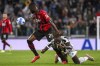 AC Milan's Fikayo Tomori, left, and Juventus' Moise Kean compete for the ball during the Serie A soccer match between Juventus and AC Milan, at the Turin Allianz stadium, Italy, Sunday, Sept. 19, 2021. (Marco Alpozzi/LaPresse via AP)