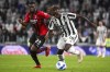 AC Milan's Fikayo Tomori, left, and Juventus' Moise Kean compete for the ball during the Serie A soccer match between Juventus and AC Milan, at the Turin Allianz stadium, Italy, Sunday, Sept. 19, 2021. (Marco Alpozzi/LaPresse via AP)