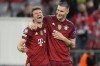 Bayern's Thomas Mueller, left, and Niklas Suele react after the Champions League group E soccer match between Bayern Munich and Dynamo Kyiv in Munich, Germany, Wednesday, Sept. 29, 2021. Bayern won 5-0. (AP Photo/Matthias Schrader)