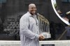 FILE - Former Chicago White Sox player and Hall of Famer Frank Thomas holds the 2005 World Series Champion trophy before a baseball game between the Kansas City Royals and the Chicago White Sox in Chicago, in this Saturday, July 18, 2015, file photo. Frank Thomas has found his Field of Dreams. The Hall of Famer has headed a venture that bought controlling interest in Go the Distance Baseball’s stake of All-Star Ballpark Heaven and the Field of Dreams Movie Site. The company said Thursday, Sept. 30, 2021, that This is Heaven LLC, a company of the 53-year-old Thomas and Chicago real estate developer Rick Heidner, bought the interests in Go the Distance Baseball owned by the Denise M. Stillman Trust.(AP Photo/Nam Y. Huh, File)