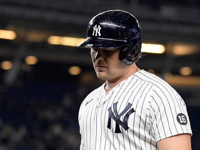 New York Yankees' Luke Voit reacts after flying out during the ninth inning of the team's baseball game against the Toronto Blue Jays on Tuesday, Sept. 7, 2021, at Yankee Stadium in New York. The Blue Jays won 5-1. (AP Photo/Bill Kostroun)