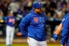 New York Mets manager Luis Rojas checks on Jeff McNeil after he was hit by a pitch during the fourth inning of a baseball game against the Miami Marlins, Thursday, Sept. 30, 2021, in New York. (AP Photo/Frank Franklin II)