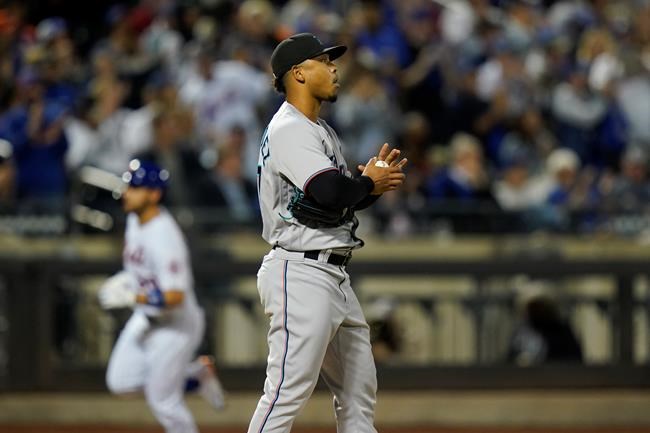 Miami Marlins starting pitcher Elieser Hernandez, right, reacts as New York Mets' Michael Conforto runs the bases after hitting a home run during the fourth inning of a baseball game, Wednesday, Sept. 29, 2021, in New York. (AP Photo/Frank Franklin II)