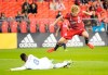 Toronto FC's Jacob Shaffelburg jumps over FC Cincinnati's Allan Cruz during the second half of MLS soccer action in Toronto, Wednesday, Sept. 29, 2021. For the second game in a row, Toronto FC faces a team that has just fired its coach as the Chicago Fire visit Sunday. THE CANADIAN PRESS/Mark Blinch