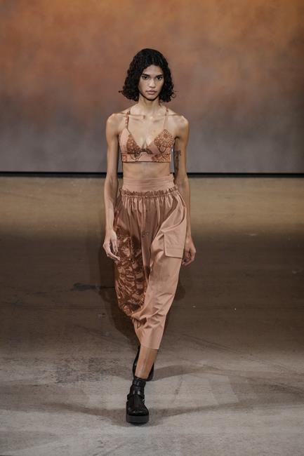 A model wears a creation for the Hermes Spring-Summer 2022 ready-to-wear fashion show presented Saturday, Oct. 2, 2021, in Paris. (AP Photo/Thibault Camus)