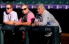 From right, Colorado Rockies interim general manager Bill Schmidt leans over the dugout rail with Marc Gustafson, senior director of scouting operations for the team, and Sterling Monfort, assistant director of scouting operations, as the Rockies warm up before a baseball game against the Los Angeles Dodgers Tuesday, Sept. 21, 2021, in Denver. (AP Photo/David Zalubowski)