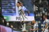 Inter Milan's Lautaro Martinez celebrates after scoring his team's second goal, during the Serie A soccer match between Sassuolo and Inter Milan, at the Reggio Emilia Mapei stadium, Italy, Saturday, Oct. 2, 2021. (Massimo Paolone/LaPresse via AP)
