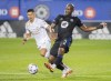 CF Montrealâ€™s Kamal Miller (3) plays a pass as Atlanta Unitedâ€™s Ronald Hernandez (2) moves in during first half MLS soccer action in Montreal, Saturday, October 2, 2021. THE CANADIAN PRESS/Graham Hughes