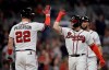 Atlanta Braves' William Contreras, right, celebrates with Joc Pederson (22) after hitting a home run off New York Mets pitcher Carlos Carrasco in the fourth inning of a baseball game Saturday, Oct. 2, 2021, in Atlanta. (AP Photo/Ben Margot)