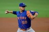 New York Mets pitcher Carlos Carrasco works against the Atlanta Braves in the first inning of a baseball game Saturday, Oct. 2, 2021, in Atlanta. (AP Photo/Ben Margot)