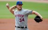 New York Mets pitcher Noah Syndergaard works against the Atlanta Braves in the first inning of a baseball game Sunday, Oct. 3, 2021, in Atlanta. (AP Photo/Ben Margot)