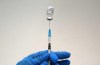 A medical worker prepares a shot of Pfizer COVID-19 vaccine, at Belgrade Fair makeshift vaccination center, Serbia, Saturday, Oct. 2, 2021. (AP Photo/Darko Vojinovic)
