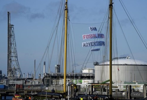 Greenpeace's Beluga II carries a banner reading 