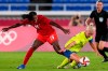 Canada's Nichelle Prince, left, and Sweden's Caroline Seger battle for the ball in the women's soccer match for the gold medal at the 2020 Summer Olympics, Friday, Aug. 6, 2021, in Yokohama, Japan.&nbsp;Alistair Johnston and Nichelle Prince have been named Canada Soccer’s players of the month for September. THE CANADIAN PRESS/AP-/Fernando Vergara