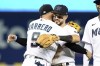 Miami Marlins third baseman Eddy Alvarez, left, and Deven Marrero celebrate after they defeated the Philadelphia Phillies, Sunday, Oct. 3, 2021, in Miami. (AP Photo/Gaston De Cardenas)