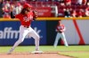 Cincinnati Reds' Jonathan India turns a double play against the Washington Nationals during the eighth inning of a baseball game Sunday, Sept. 26, 2021, in Cincinnati. The Reds defeated the Nationals 9-2. (AP Photo/Jay LaPrete)