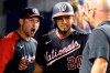 Washington Nationals' Keibert Ruiz (20) is congratulated after scoring a run on a hit by Luis Garcia during the fifth inning of a baseball game against the Miami Marlins, Monday, Sept. 20, 2021, in Miami. (AP Photo/Marta Lavandier)