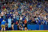 Toronto Blue Jays centre fielder George Springer (4) salutes the crowd after MLB baseball action against the Baltimore Orioles in Toronto, Sunday, Oct. 3, 2021. The Blue Jays won 12-4. (Frank Gunn/The Canadian Press via AP)