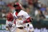 Texas Rangers' Adolis Garcia, front, and Andy Ibanez, rear, jog to the dugout after Garcia hit a two-run home run that scored them in the fifth inning of a baseball game against the Los Angeles Angels in Arlington, Texas, Thursday, Sept. 30, 2021. (AP Photo/Tony Gutierrez)