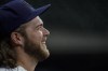 Milwaukee Brewers' Corbin Burnes smiles at a practice for the Game 1 of the NLDS baseball game Tuesday, Oct. 5, 2021, in Milwaukee. The Brewers plays the Atlanta Braves in Game 1 on Friday, Oct. 8, 2021. (AP Photo/Morry Gash)