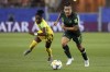 FILE - In this June 18, 2019, file photo, Australia's Lisa De Vanna, right, challenges for the ball with Jamaica's Den-Den Blackwood during the Women's World Cup Group C soccer match in Grenoble, France. De Vanna, who played 150 games for Australia and was second on the list of all-time of scorers for the women's national team with 47 goals, said she first experienced harassment, abuse and bullying in 2001 when she joined a national women's squad at age 17. (AP Photo/Laurent Cipriani, File)