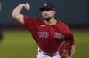 Boston Red Sox starting pitcher Nathan Eovaldi delivers to the New York Yankees in the first inning of the American League Wild Card playoff game at Fenway Park, Tuesday Oct. 5, 2021 in Boston. (AP Photo/Charles Krupa)