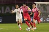 South Korea's Son Heung-min, center, dribbles the ball during the final round of the Asian zone group A qualifying soccer match against Syria for the FIFA World Cup Qatar 2022 at Ansan Wa Stadium in Ansan, South Korea, Thursday, Oct. 7, 2021. (AP Photo/Ahn Young-joon)