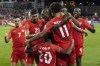 Canada's captain Atiba Hutchinson stands in the centre of the celebrations as the team celebrates their third goal against El Salvador during second half World Cup qualifying action in Toronto on Wednesday, September 8, 2021. THE CANADIAN PRESS/Chris Young