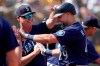 Seattle Mariners' Cal Raleigh, right, is congratulated by manager Scott Servais after hitting a two-run home run against the Oakland Athletics during the fifth inning of a baseball game in Oakland, Calif., Thursday, Sept. 23, 2021. (AP Photo/Jeff Chiu)