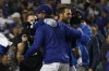 The Los Angeles Dodgers celebrate with Chris Taylor, right, after he hit a home run during the ninth inning to win a National League Wild Card playoff baseball game 3-1 over the St. Louis Cardinals Wednesday, Oct. 6, 2021, in Los Angeles. Cody Bellinger also scored. (AP Photo/Marcio Jose Sanchez)