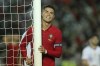 Portugal's Cristiano Ronaldo reacts after failing to score during the international friendly soccer match between Portugal and Qatar at the Algarve stadium outside Faro, Portugal, Saturday, Oct. 9, 2021. (AP Photo/Joao Matos)