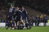 Scotland's Scott McTominay is mobbed by teammates after scoring his sides 3rd goal of the game during the World Cup 2022 group F qualifying soccer match between Scotland and Israel at Hampden Park stadium in Glasgow, Scotland, Saturday, Oct. 9, 2021. (AP Photo/Scott Heppell)