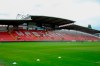 This photo provided by Wrexham FC shows the empty stands of the Racecourse Ground in Wrexham, Wales, Saturday, Sept. 11, 2021. It has been described as a “crash course in football club ownership” and the two Hollywood stars who bought a beleaguered team in English soccer's fifth tier with the lofty aim of transforming it into a global force are certainly learning on the job. (Gemma Thomas/Wrexham FC via AP)