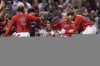 Boston Red Sox catcher Christian Vazquez, center, celebrates with teammates after hitting a two-run walk-off home run during the thirteenth inning against the Tampa Bay Rays during Game 3 of a baseball American League Division Series, Sunday, Oct. 10, 2021, in Boston. The Red Sox won 6-4. (AP Photo/Charles Krupa)
