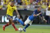 Brazil's Neymar falls, chased by Colombia's Wilmar Barrios, during a qualifying soccer match for the FIFA World Cup Qatar 2022 in Barranquilla, Colombia, Sunday, Oct. 10, 2021. (AP Photo/Fernando Vergara)