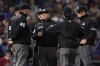 Umpires confer about the ruling on a double hit by Tampa Bay Rays center fielder Kevin Kiermaier during the thirteenth inning against the Boston Red Sox during Game 3 of a baseball American League Division Series, Sunday, Oct. 10, 2021, in Boston. (AP Photo/Charles Krupa)