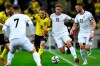 Sweden's Kristoffer Olsson, center left, and Kosovo's Mergim Vojvoda battle for the ball during the World Cup 2022 group B qualifying soccer match between Sweden and Kosovo at Friends Arena in Stockholm, Sweden, Saturday Oct. 09, 2021. (Erik Simander/TT via AP)