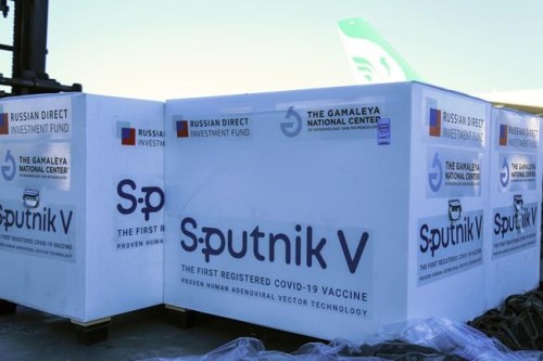 FILE - In this Feb. 4, 2021, file photo released by Imam Khomeini Airport City, Russian-made Sputnik V COVID-19 vaccines are unloaded at the Tehran's Imam Khomeini International Airport. Millions from Latin America to the Middle East are waiting for promised doses of the Russian-made Sputnik V coronavirus vaccine due to manufacturing problems and other issues. Virus-battered Iran has received only about 1.3 million doses from Russia out of 60 million doses it had been promised. (Saeed Kaari/IKAC via AP, File)