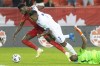 Canada's Alphonso Davies (left) goes down under Harold Cummings' challenge after rounding Panama goalkeeper Luis Mejia during first half World Cup qualifying action in Toronto, on Wednesday, October 13, 2021. THE CANADIAN PRESS/Chris Young