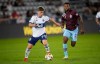 Vancouver Whitecaps midfielder Ryan Gauld, left, brings the ball down the pitch with Colorado Rapids midfielder Kellyn Acosta in pursuit in the second half of an MLS soccer match Sunday, Sept. 19, 2021, in Commerce City, Colo. THE CANADIAN PRESS/AP-David Zalubowski