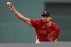 Boston Red Sox pitcher Nathan Eovaldi (17) delivers against the Tampa Bay Rays during the first inning during game 3 of a baseball American League Division Series, Sunday, Oct. 10, 2021, in Boston. (AP Photo/Charles Krupa)