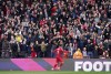 Liverpool's Roberto Firmino celebrates scoring their side's third goal of the game during the English Premier League soccer match between Watford and Liverpool at Vicarage Road, Watford, England, Saturday, Oct. 16, 2021. (Tess Derry/PA via AP)