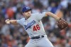 Los Angeles Dodgers' Corey Knebel pitches against the San Francisco Giants during the first inning of Game 5 of a baseball National League Division Series Thursday, Oct. 14, 2021, in San Francisco. (AP Photo/John Hefti)