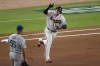 Atlanta Braves' Austin Riley runs past Los Angeles Dodgers first baseman Albert Pujols (55) after hitting a home run during the fourth inning in Game 1 of baseball's National League Championship Series Saturday, Oct. 16, 2021, in Atlanta. (AP Photo/John Bazemore)